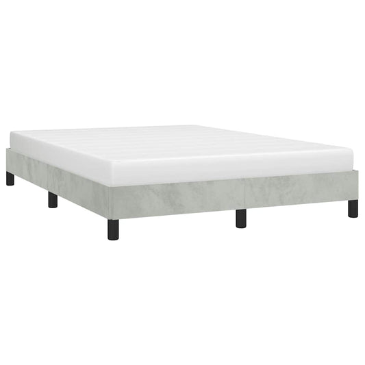 Modern gray upholstered bed frame with white mattress on black legs