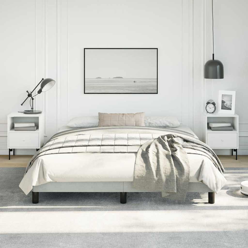 Gray upholstered bed frame with wooden slats and black legs