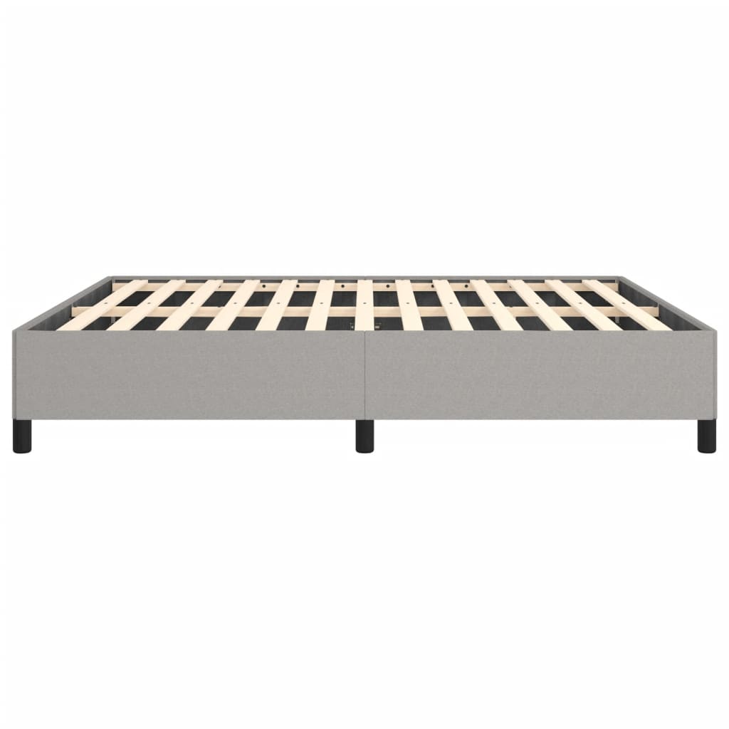Modern grey upholstered bed frame with wooden slats and black legs