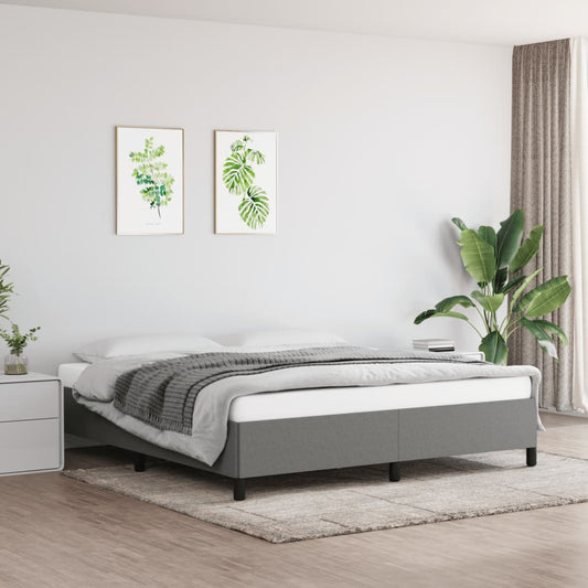 Modern grey upholstered twin bed frame with minimalist design and wooden legs