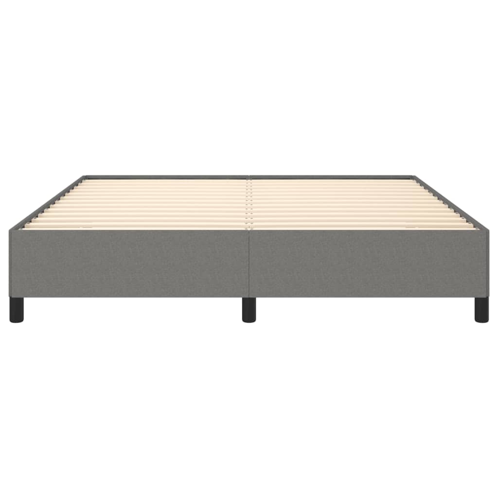Grey upholstered bed frame with white mattress