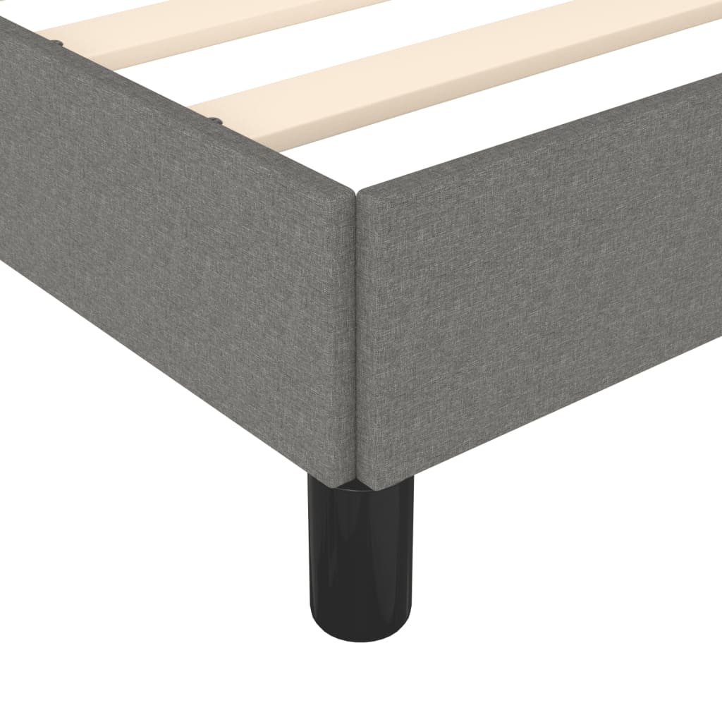 Grey upholstered platform bed frame with wooden slats