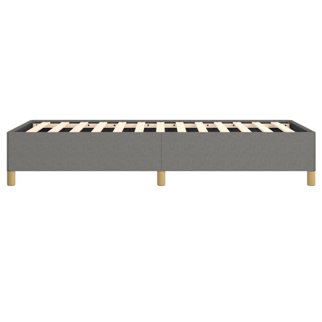 Grey upholstered twin bed frame with wooden slats and gold legs