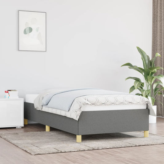 Grey upholstered single bed frame with wooden legs