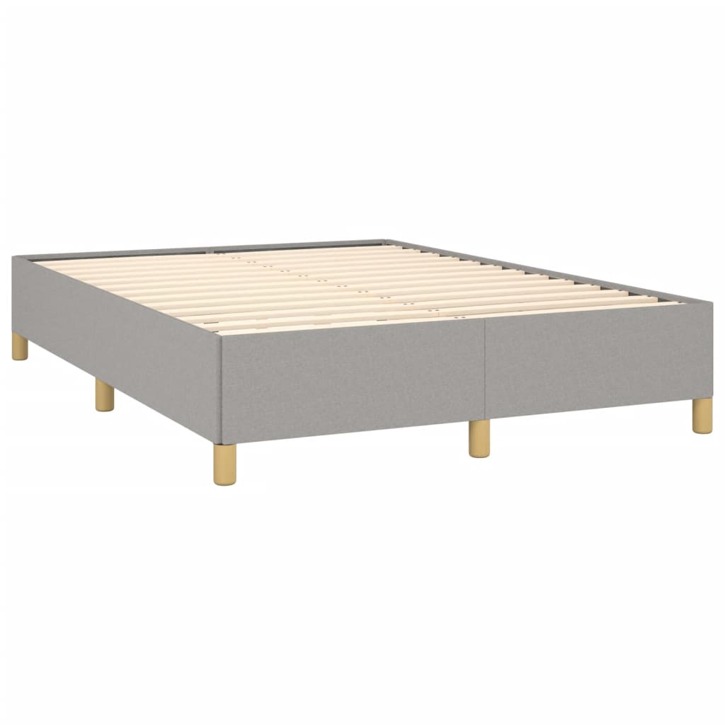 Grey upholstered queen bed frame with natural wood legs