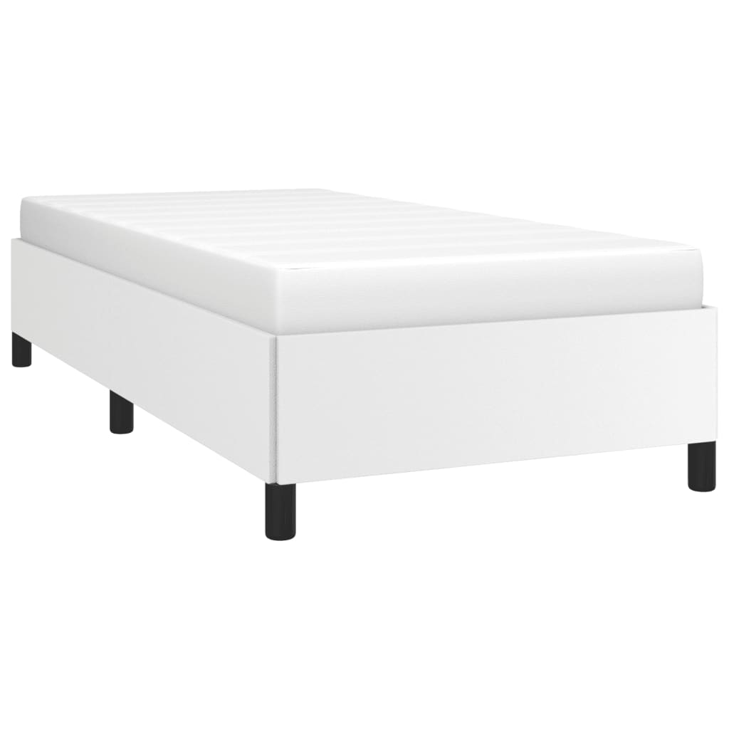 White upholstered bed frame with black legs and a white mattress