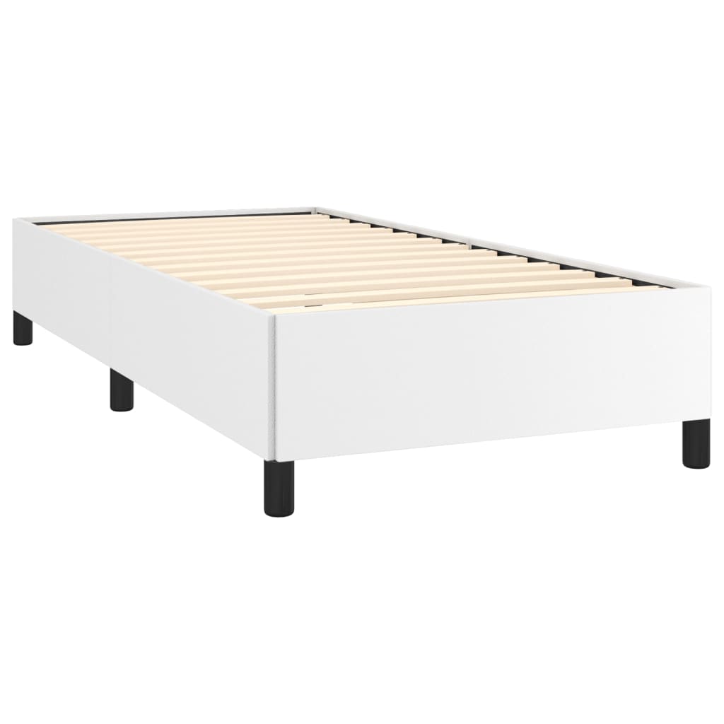 Modern white platform bed frame with black legs featuring a minimalist design suitable for a bedroom