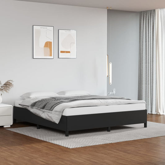 Platform bed frame with dark gray upholstery and wooden legs