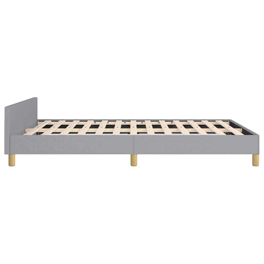 Modern grey upholstered platform bed frame with wooden slats and tapered legs