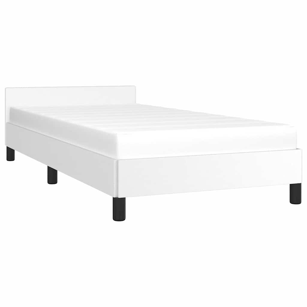 White upholstered bed frame with a simple headboard and black legs