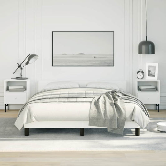 Minimalist white platform bed frame with grey striped duvet