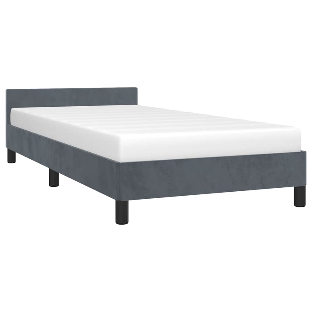 Gray upholstered twin bed frame with white mattress