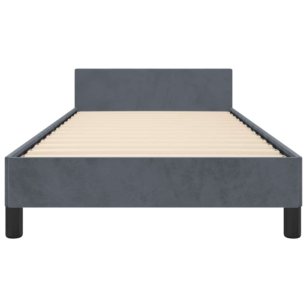 Gray upholstered twin bed frame with a white mattress and black legs