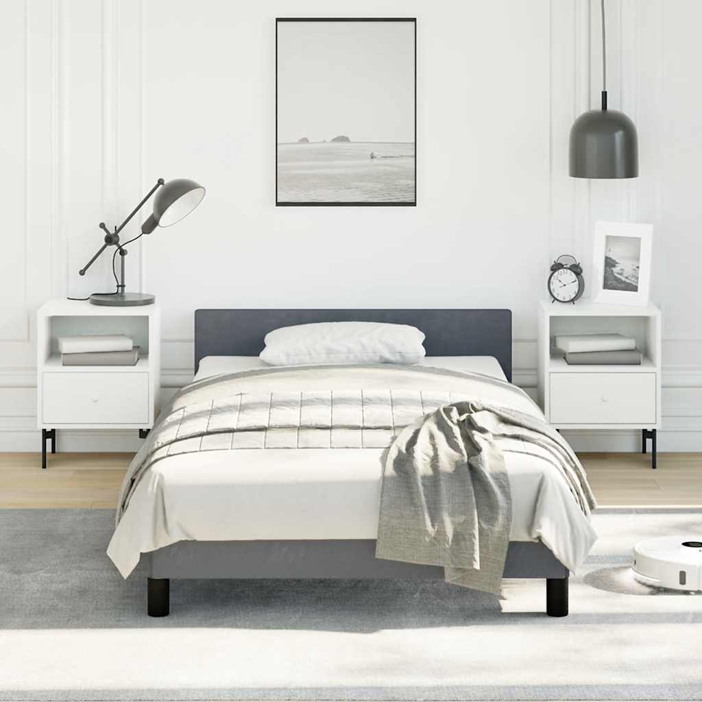 Modern upholstered twin bed frame in charcoal gray with white bedding