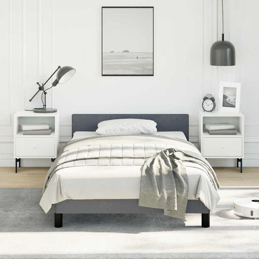 Modern upholstered twin bed frame in charcoal gray with white bedding