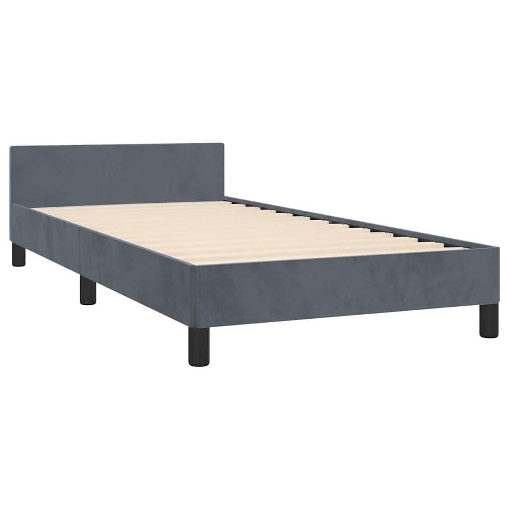 Modern grey upholstered twin bed frame with a simple headboard