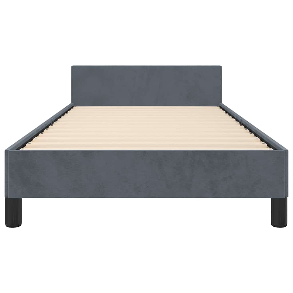 Dark gray upholstered twin bed frame with white mattress and black legs