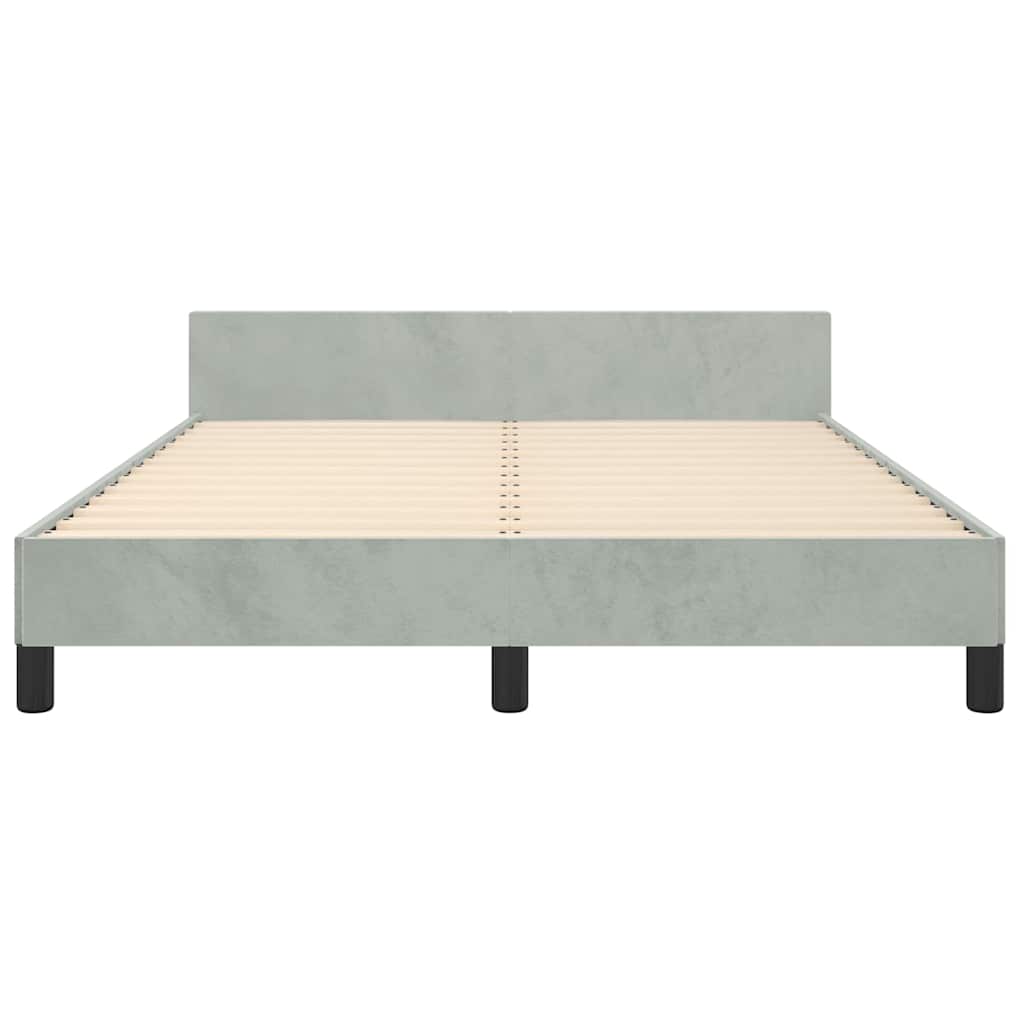 Modern grey upholstered bed frame with white mattress