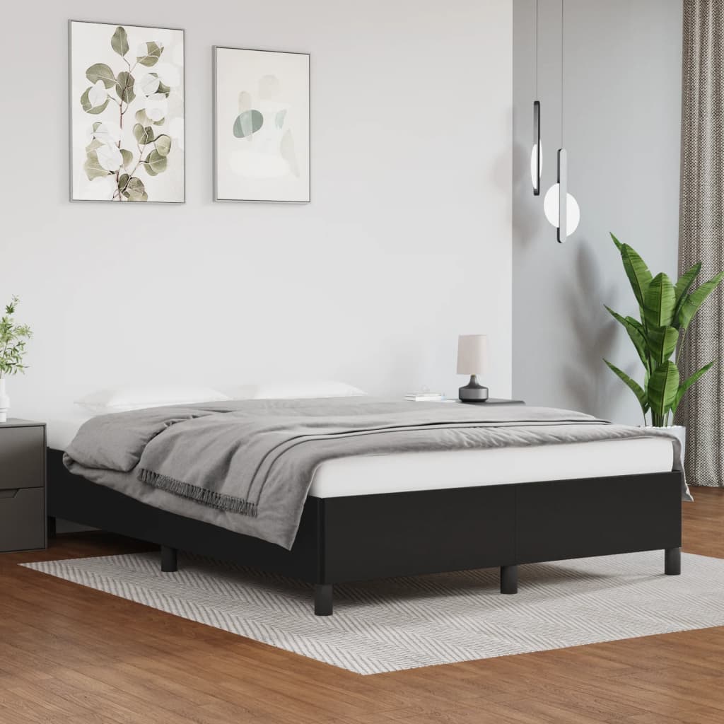 Platform bed frame with dark grey upholstery and clean lines