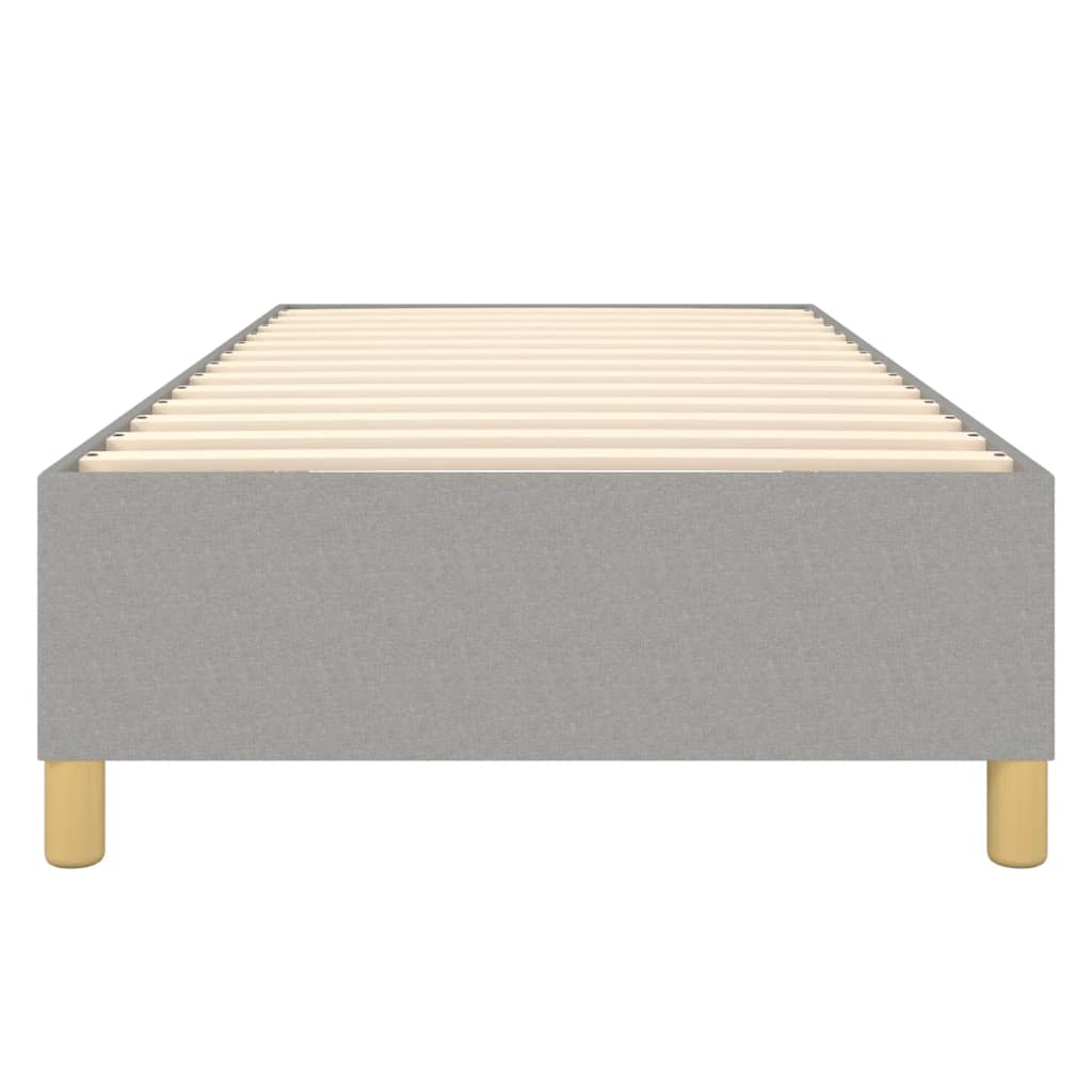 Modern gray upholstered bed frame with wooden slats and round legs