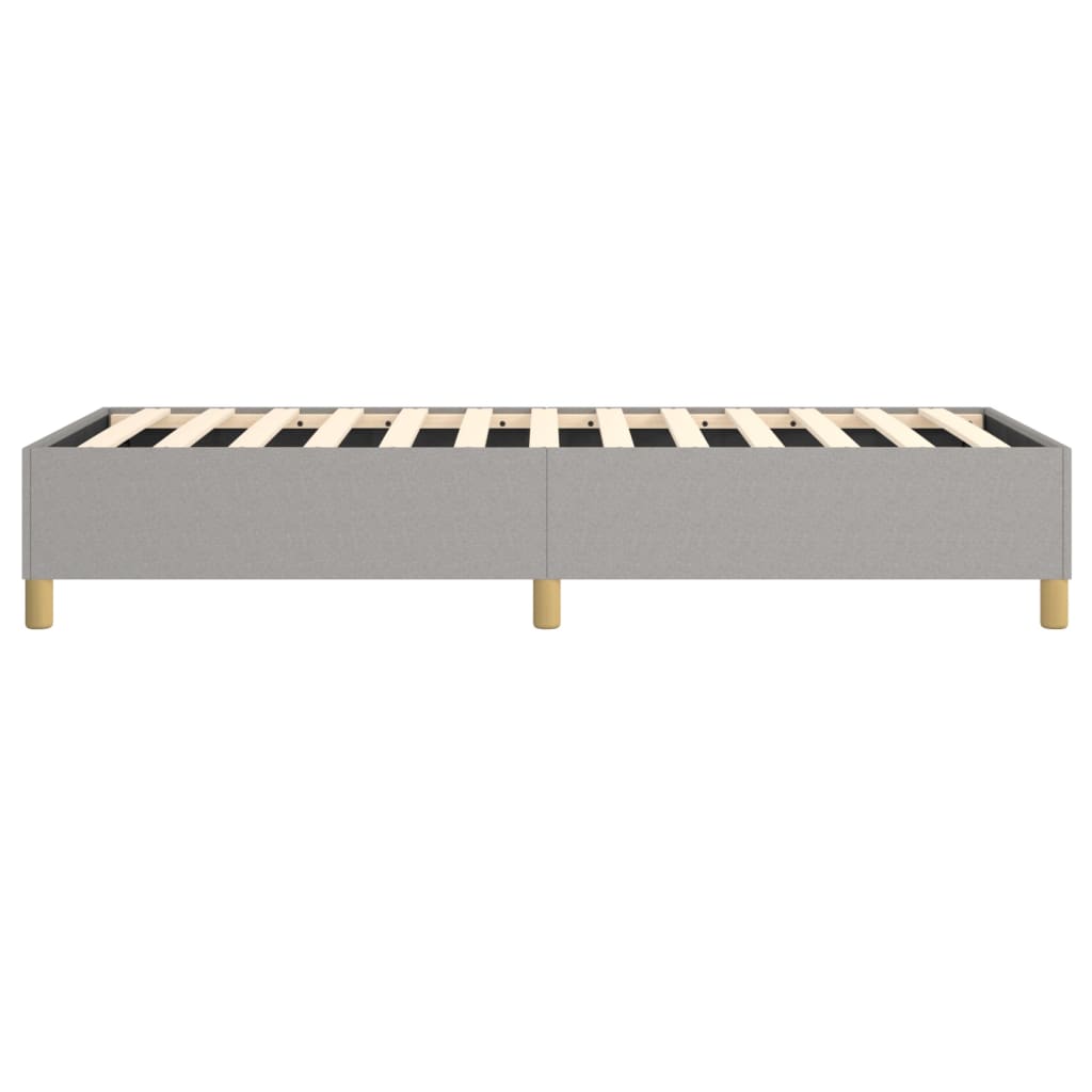 Gray fabric upholstered bed frame with wooden slats and gold legs