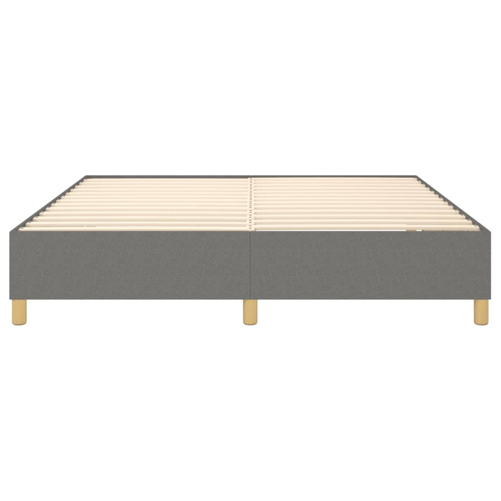 Grey upholstered bed frame with wooden slats and legs