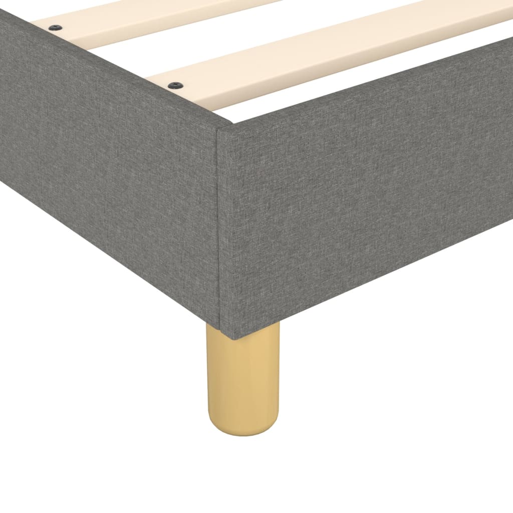 Gray upholstered platform bed frame with wooden slats and tapered legs