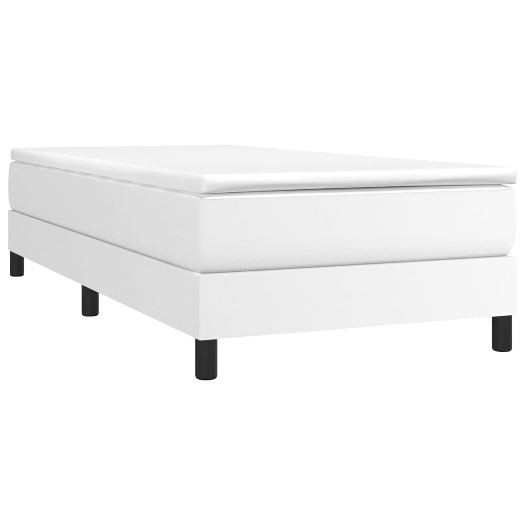 Clean white upholstered box spring bed frame with black legs