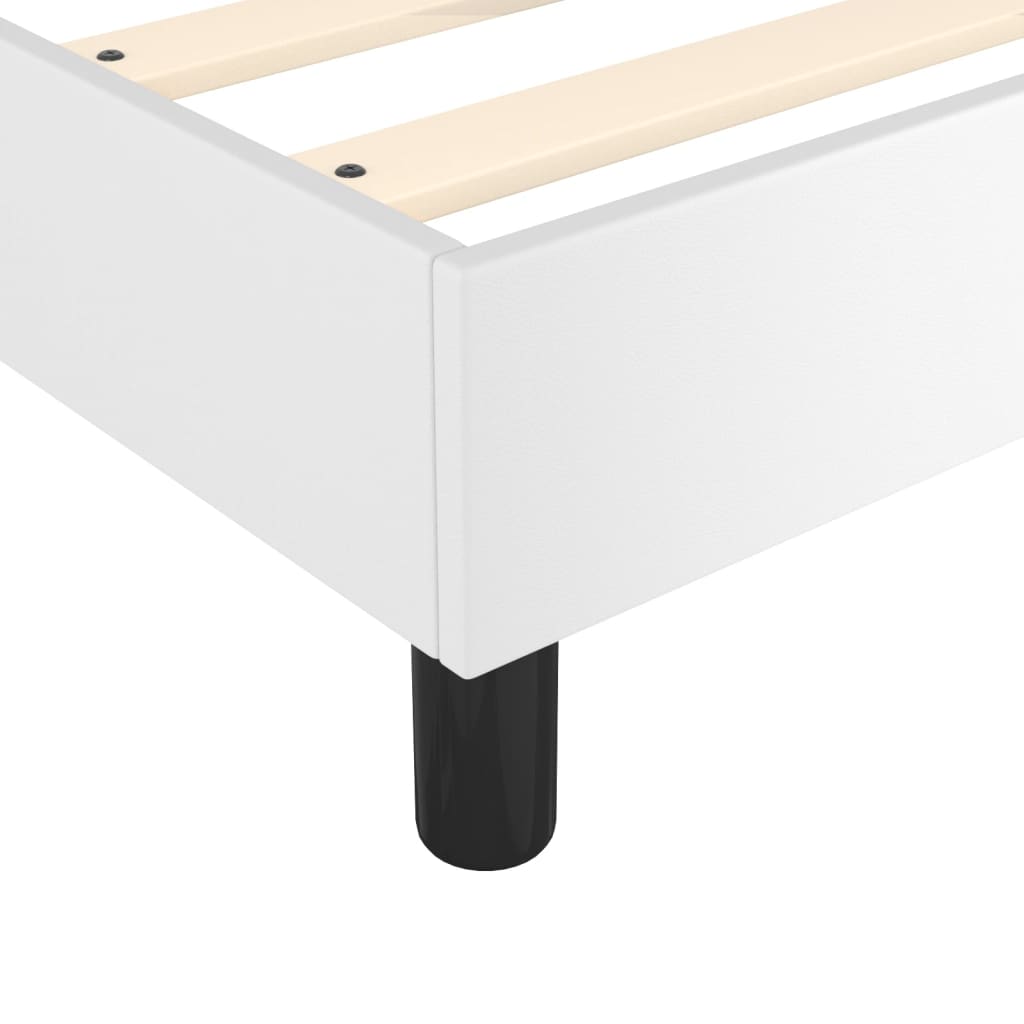 White wooden platform bed frame with black legs