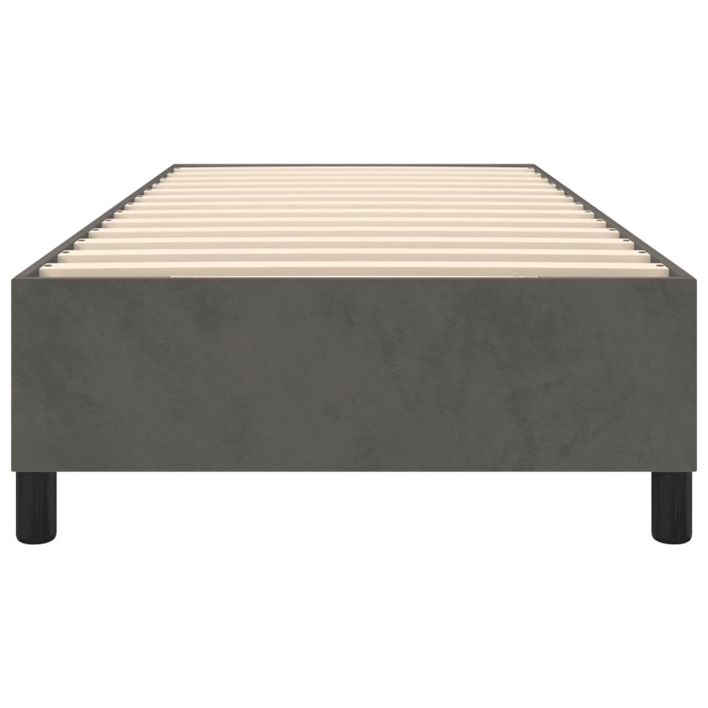 Gray upholstered twin bed frame with wooden slats