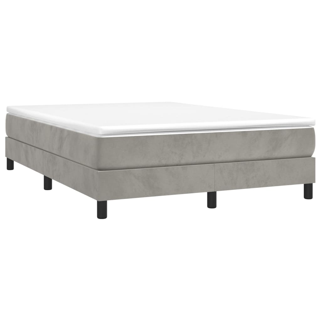 Gray upholstered bed frame with white mattress