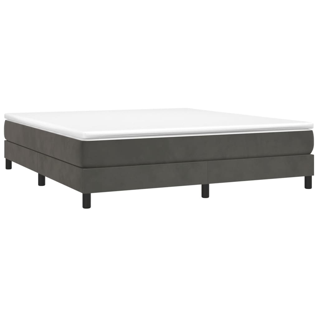 Dark grey upholstered bed base with white mattress topper
