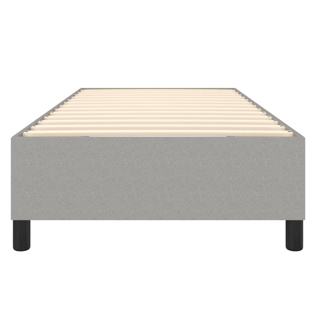 Grey fabric bed frame with wooden slats and black legs