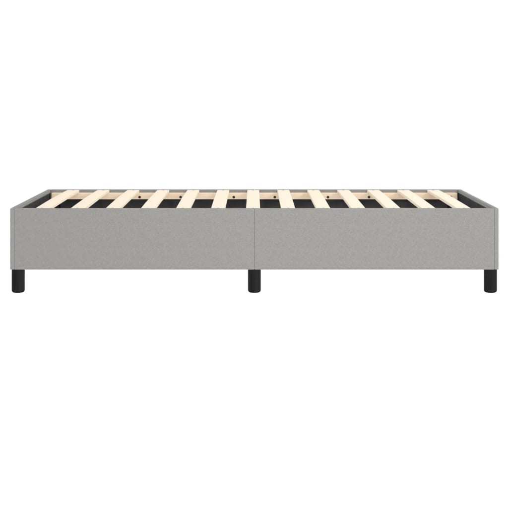 Grey fabric twin bed frame with wooden slats