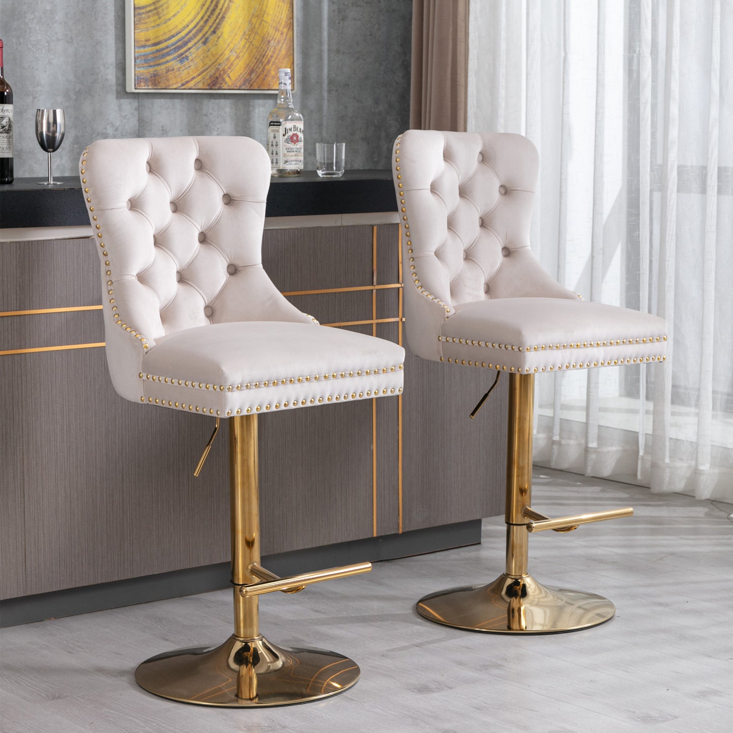 Cream velvet tufted bar stool with gold base and nailhead trim