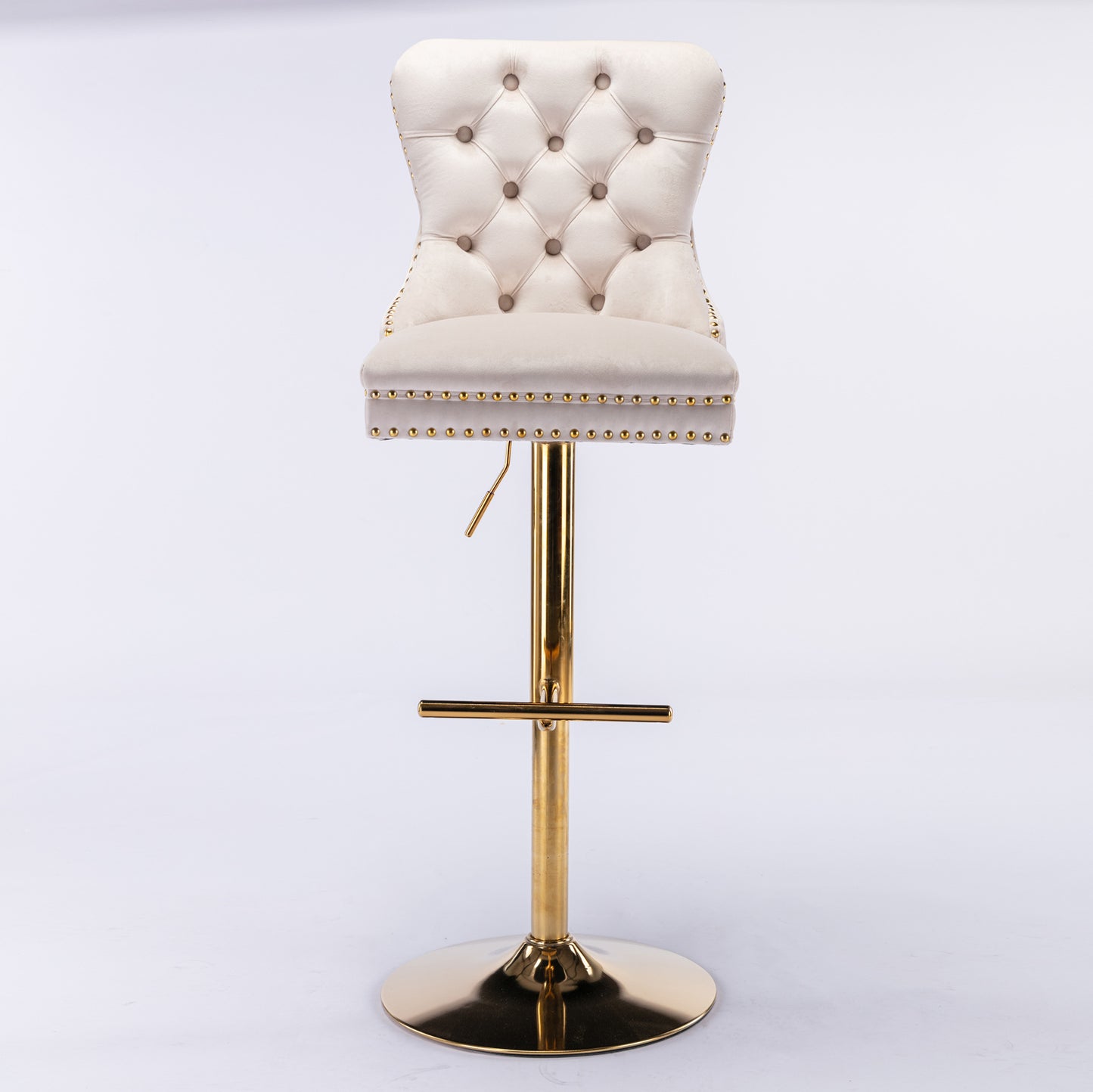 Tufted cream velvet bar stool with gold trim and adjustable brass pedestal