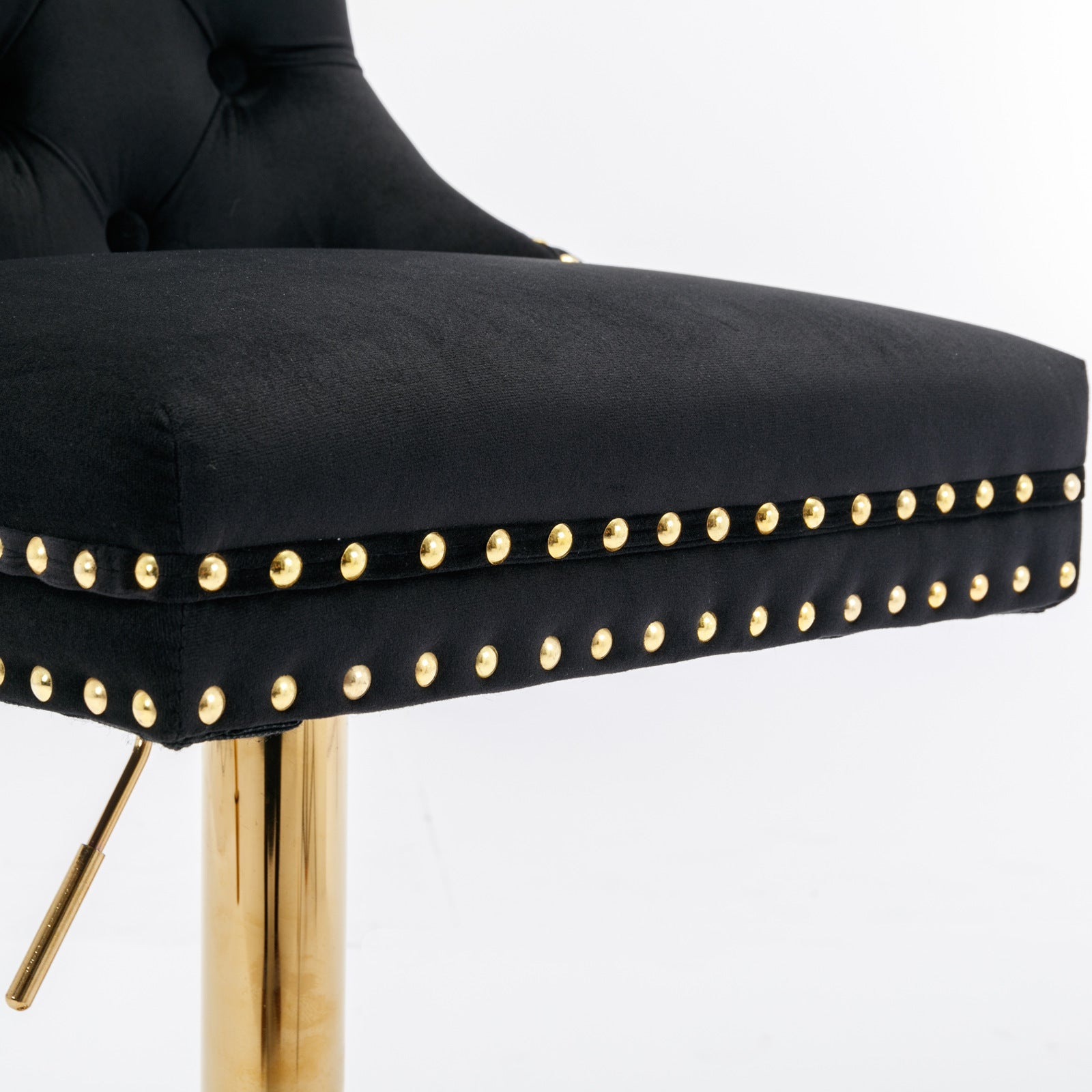 Black velvet bar stool with gold nailhead trim and chrome adjustable pedestal