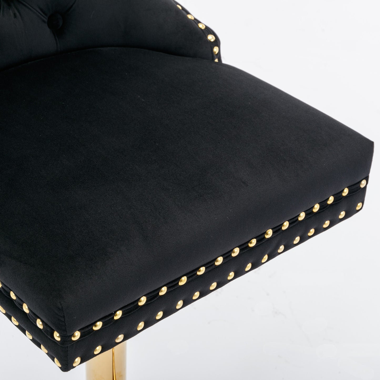 Black velvet bar stool with gold nailhead trim
