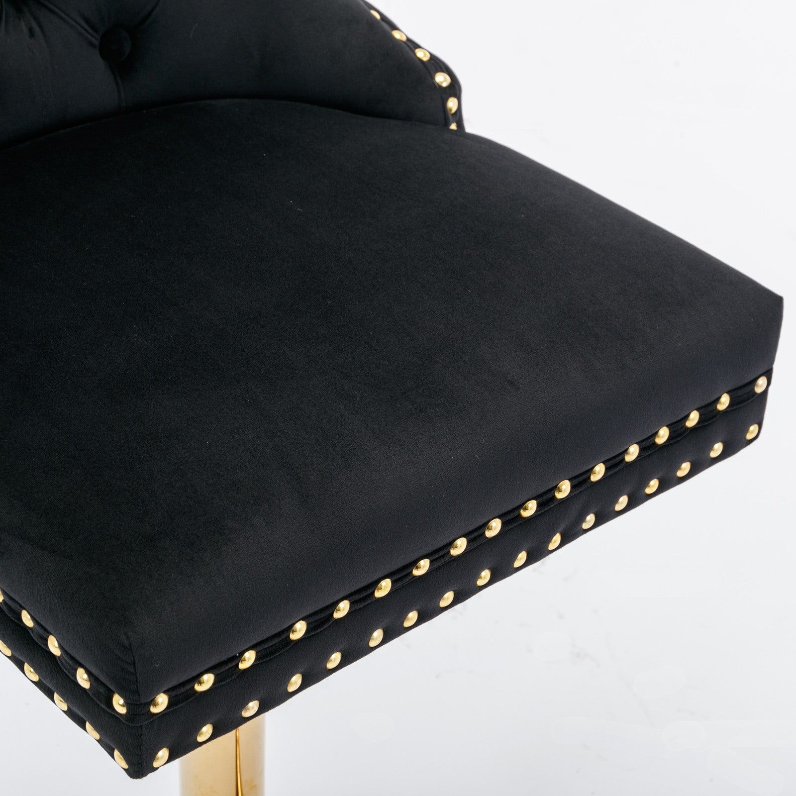 Black velvet bar stool with gold nailhead trim