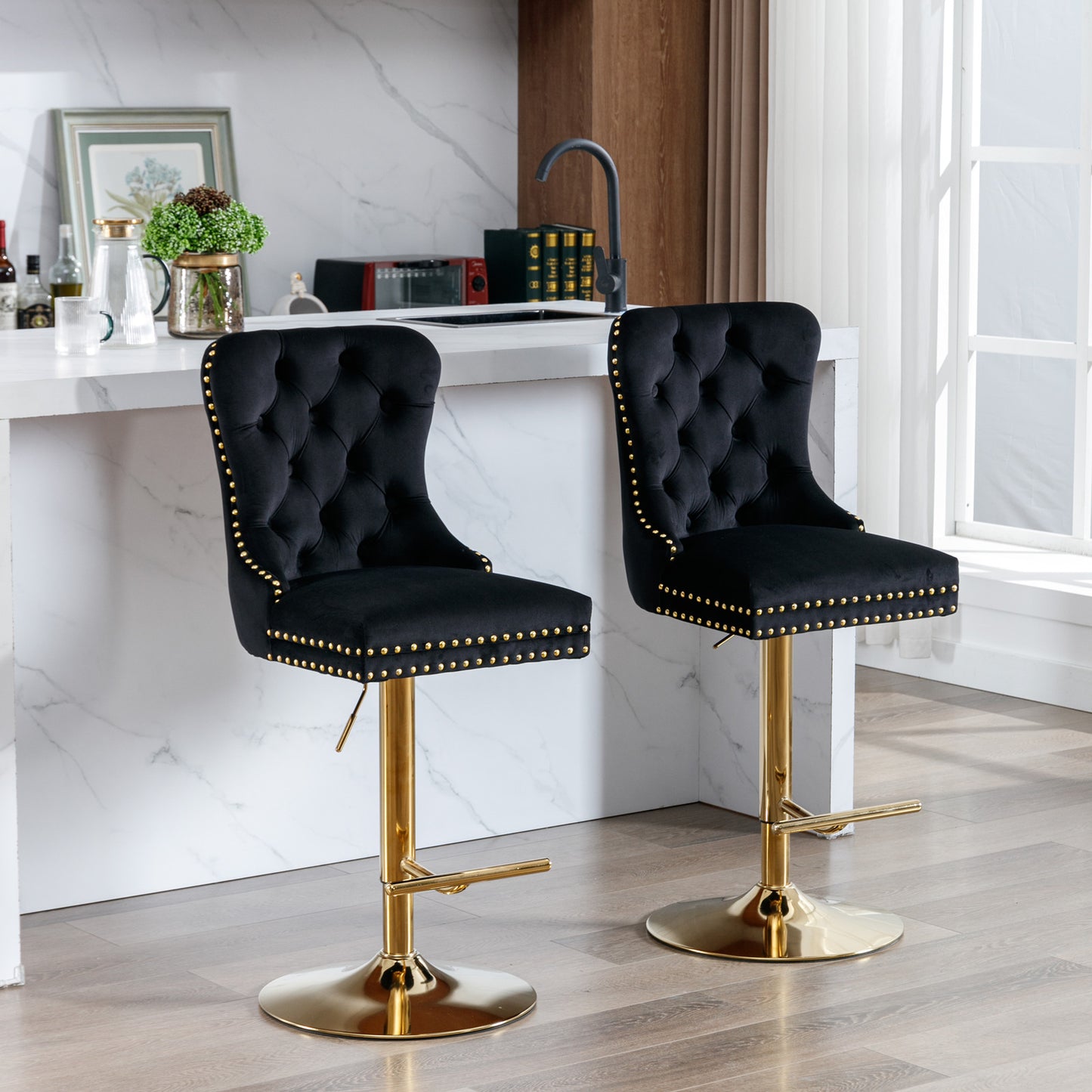 Black velvet tufted bar stool with gold studded trim and base