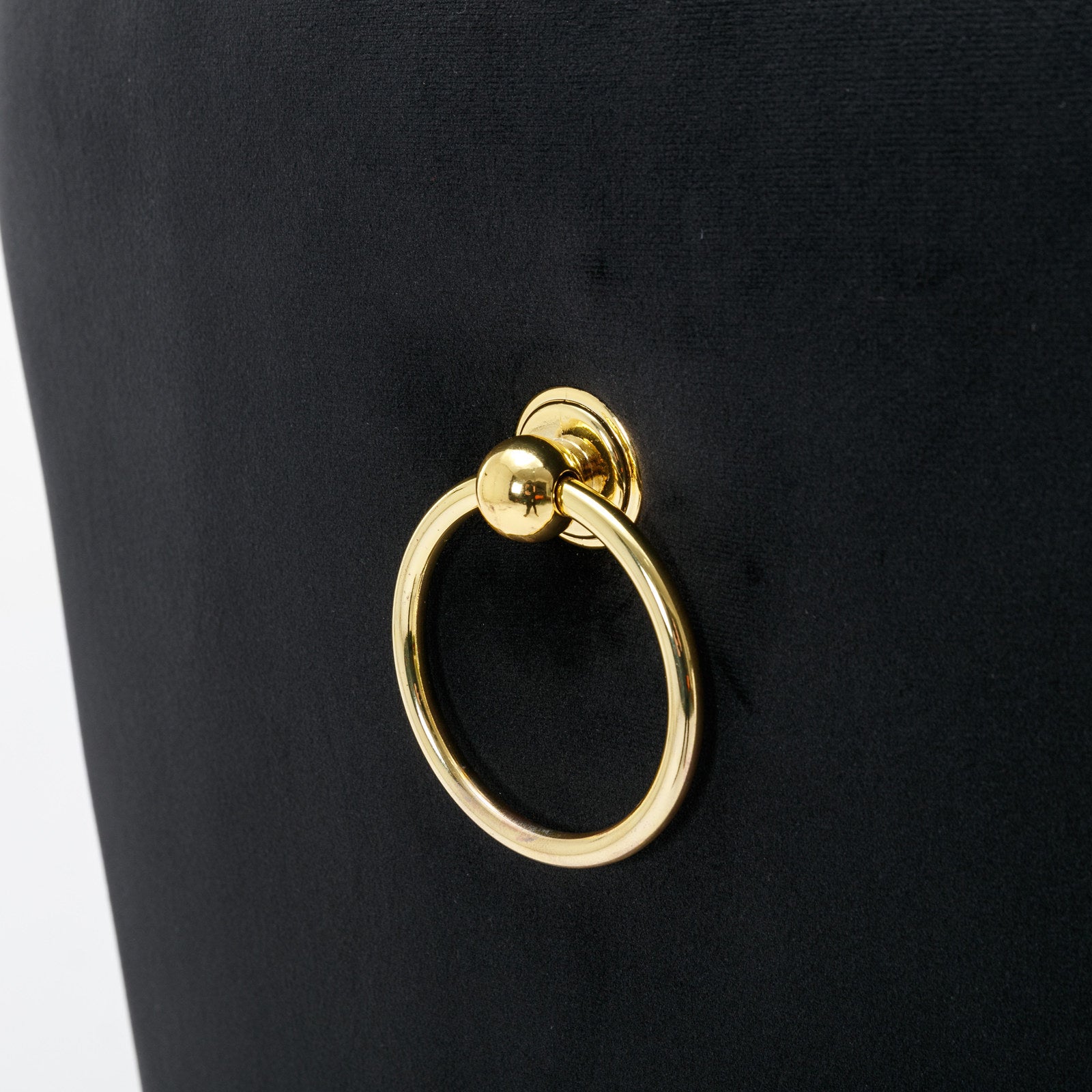Black velvet dining chair with gold ring pull