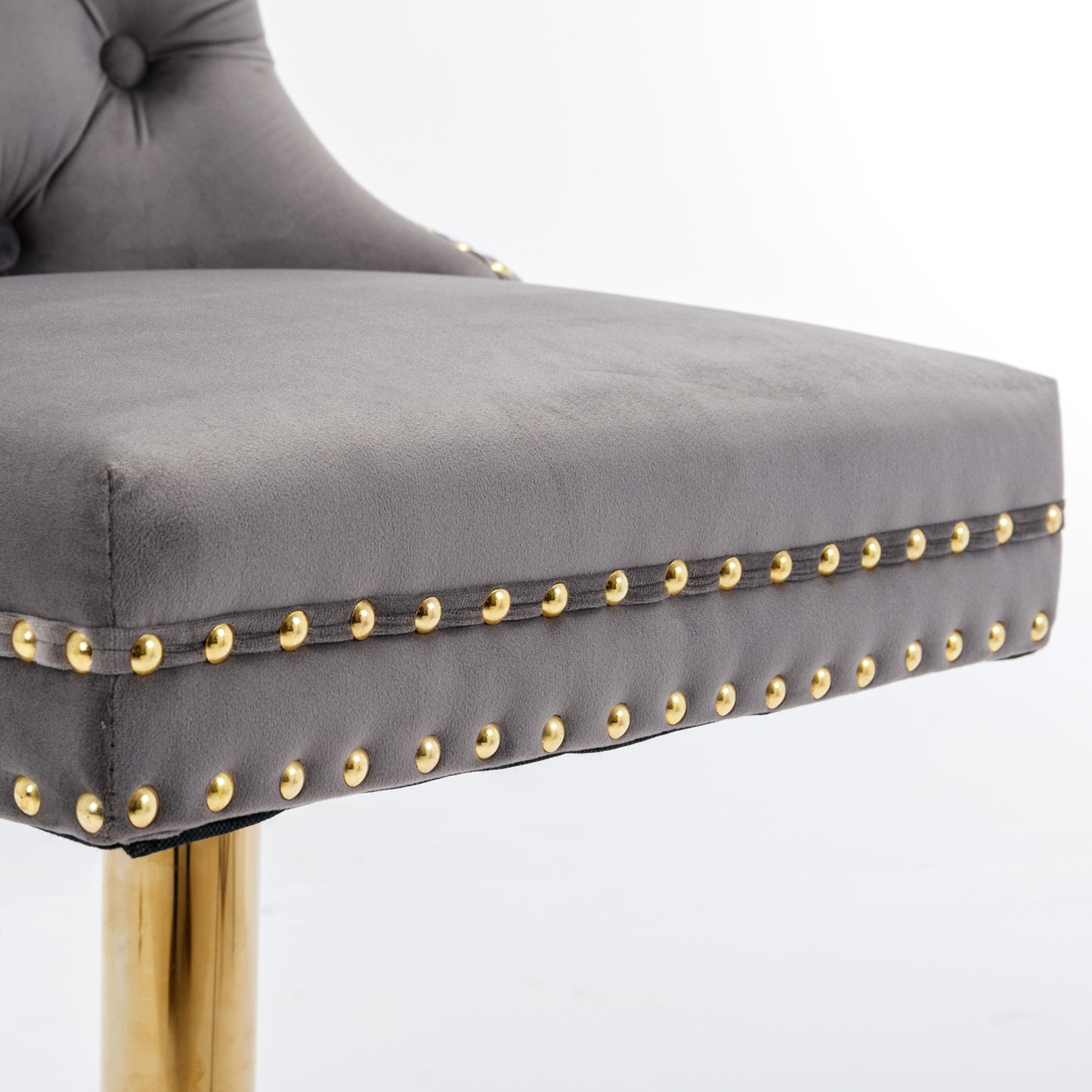 Grey velvet bar stool with gold nailhead trim and chrome base