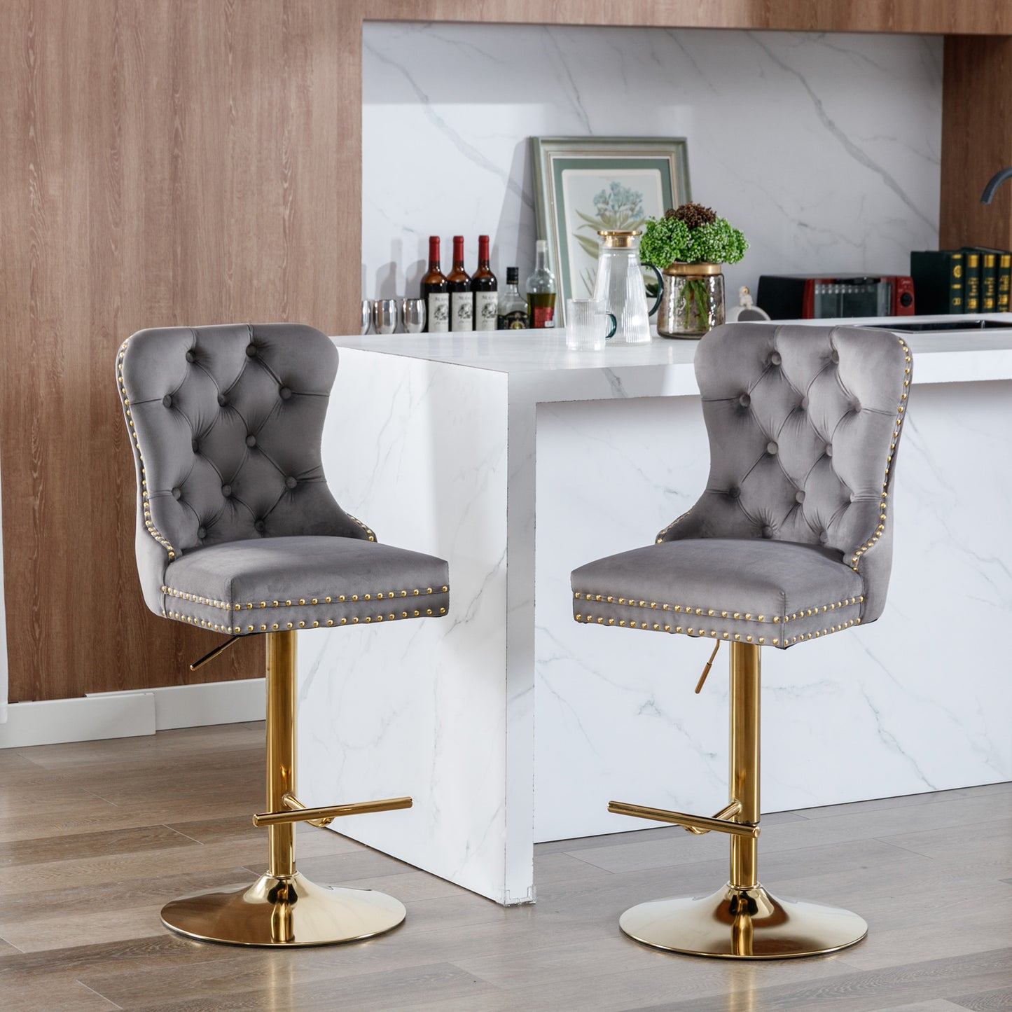 Grey velvet bar stool with gold trim and adjustable height