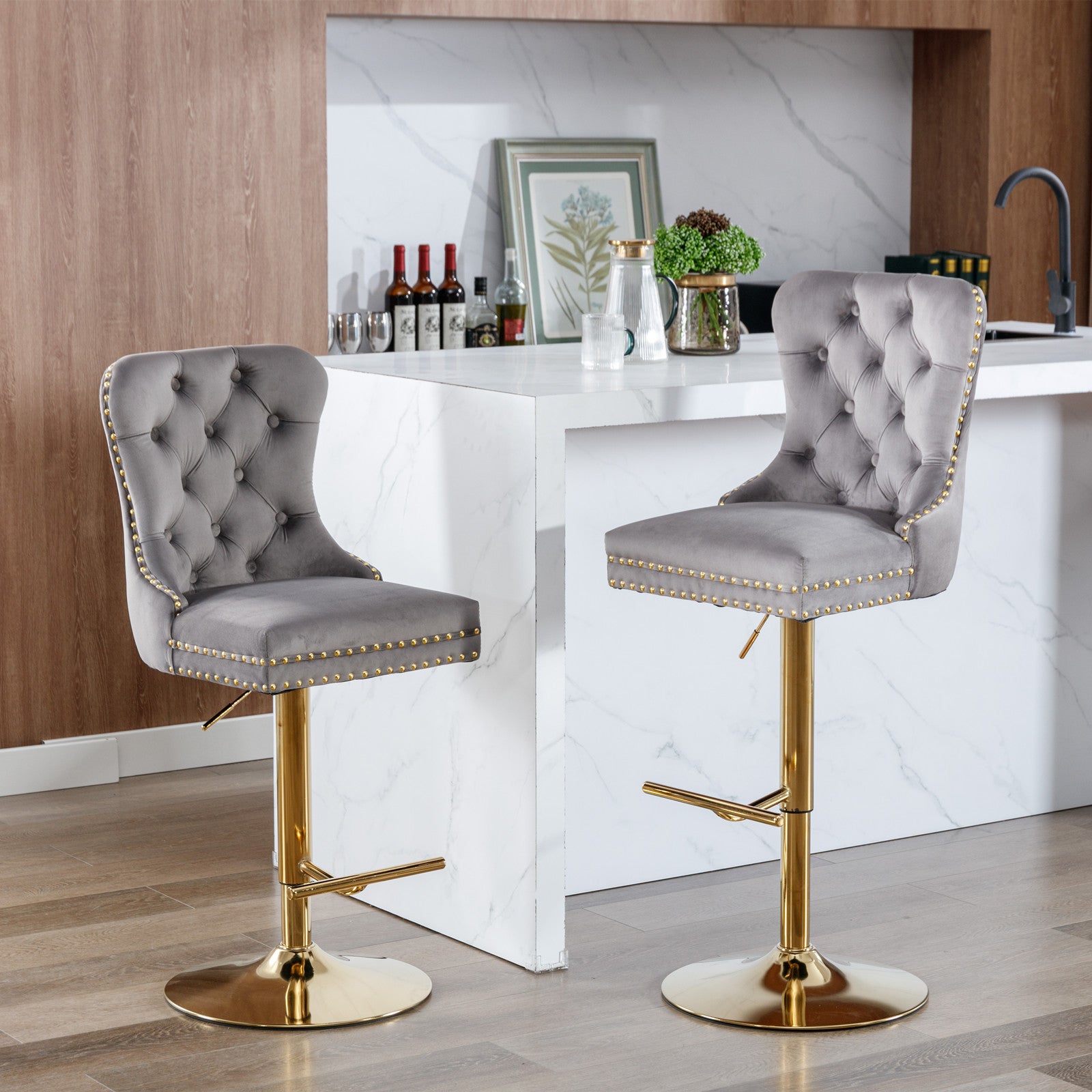 Gray velvet bar stool with gold accents and adjustable height