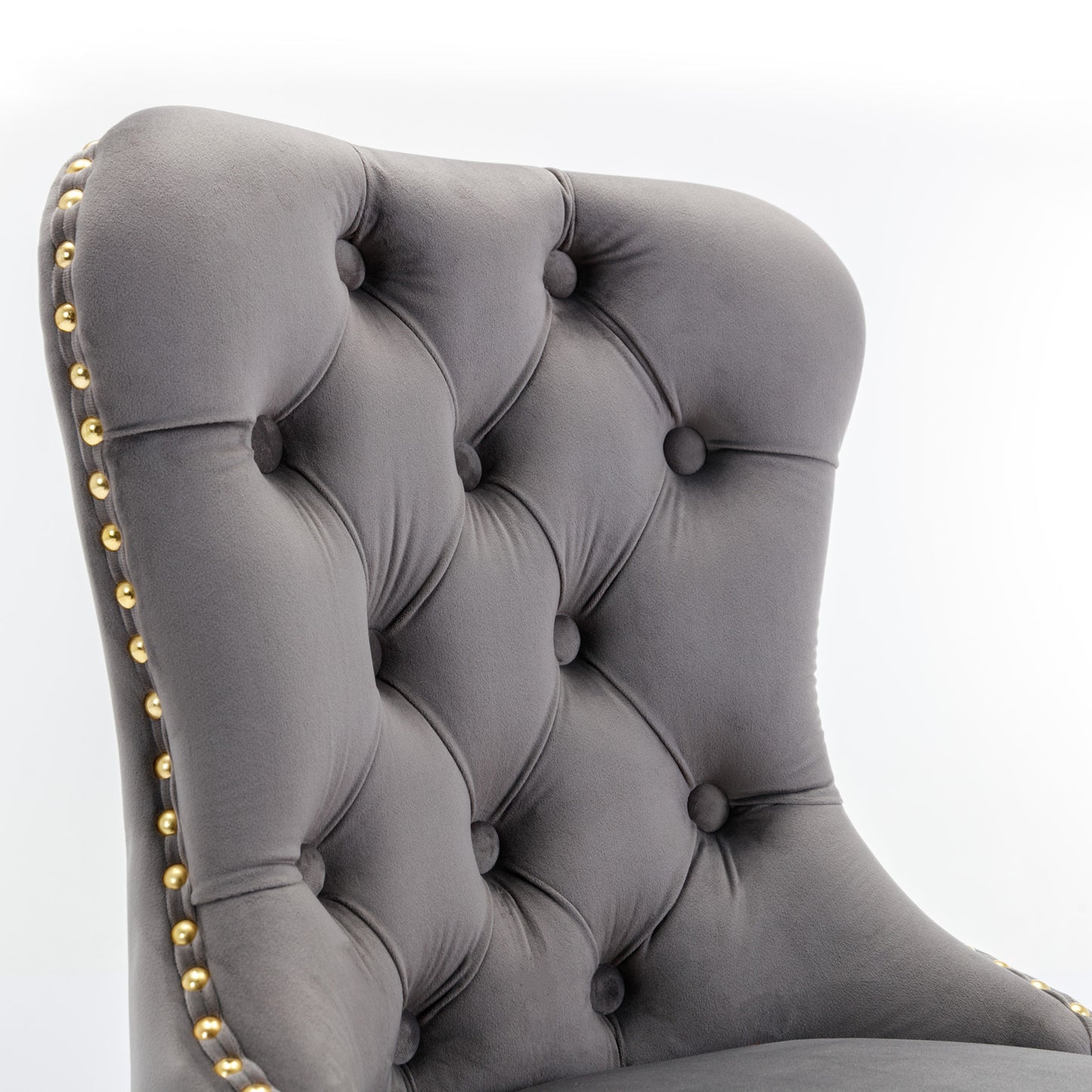Grey velvet tufted accent chair with gold nailhead trim