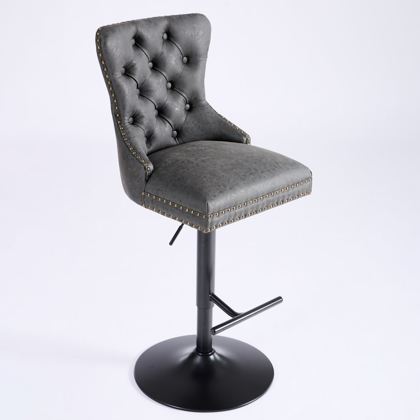 Adjustable grey faux leather bar stool with diamond tufting and brass nailhead trim