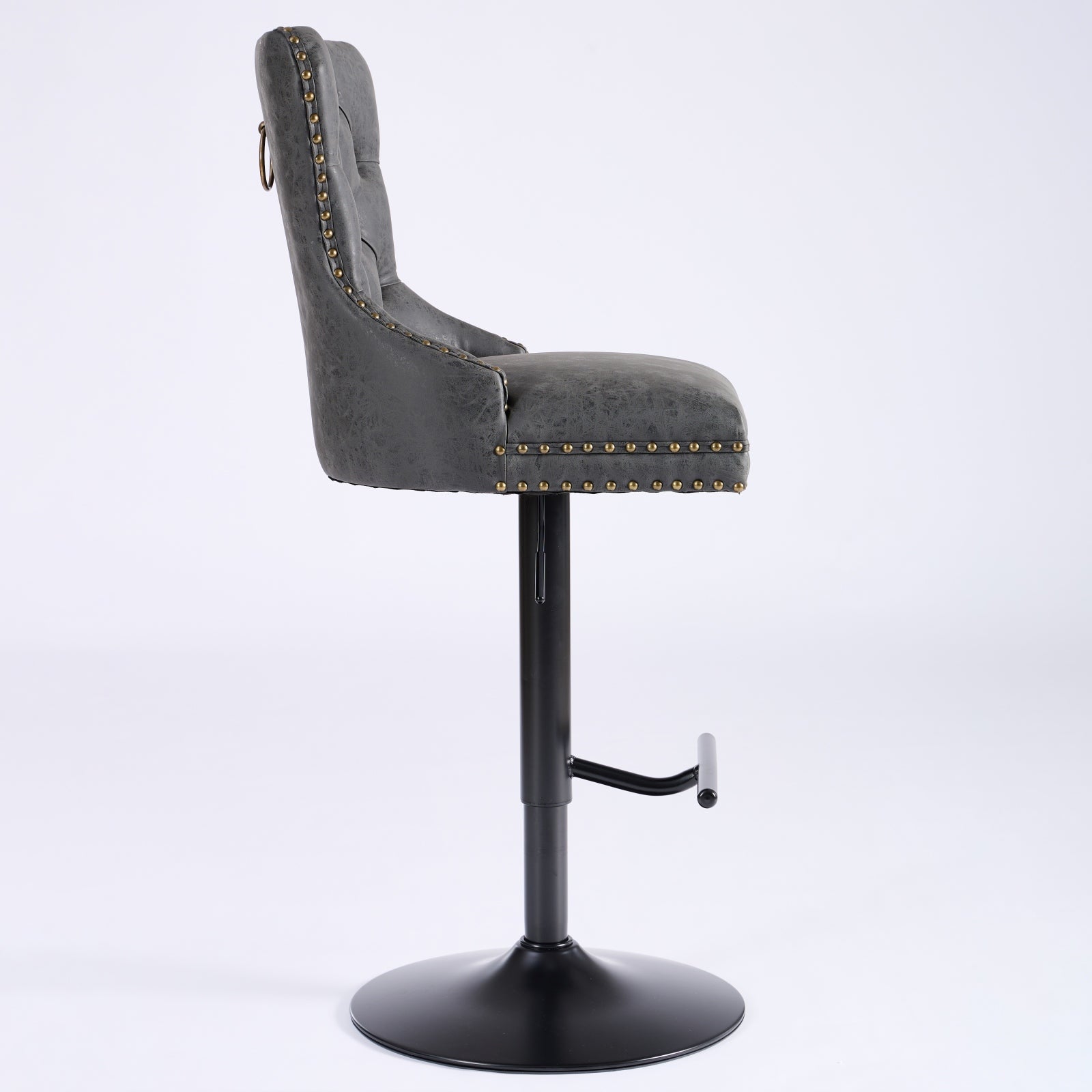 Grey tufted bar stool with gold nailhead trim and ring pull