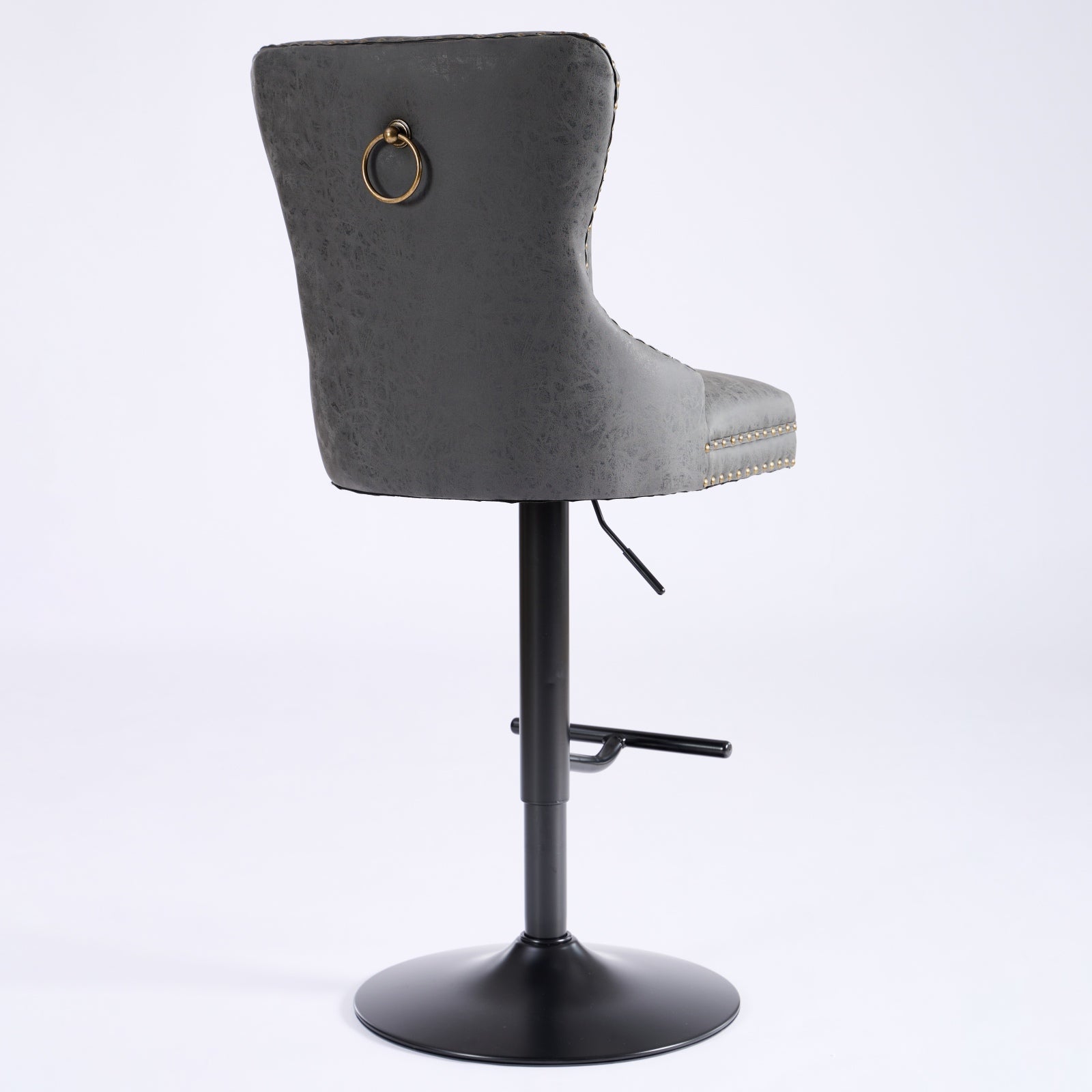 Grey velvet bar stool with gold ring accent and brass nailhead trim