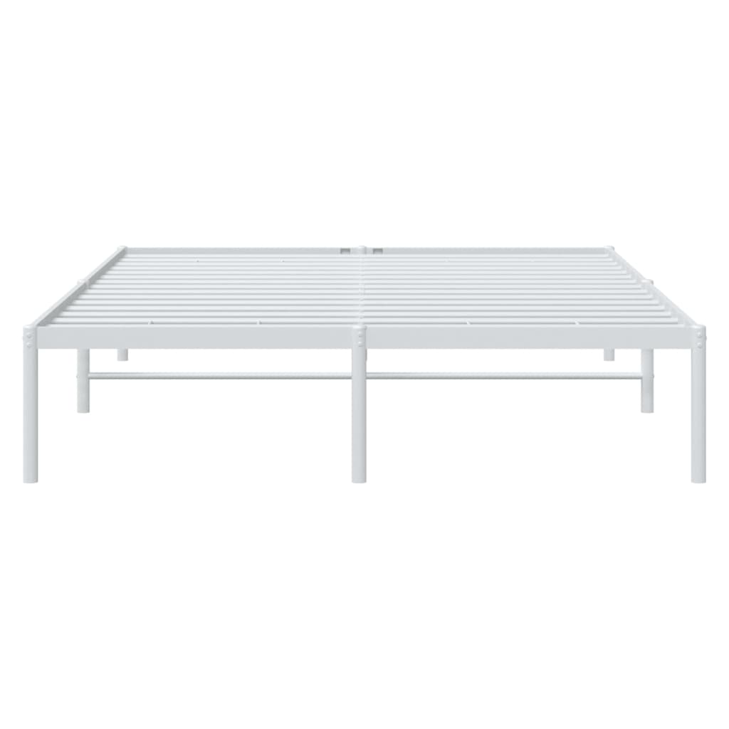 Minimalist white metal bed frame with beige pillows and grey bedding