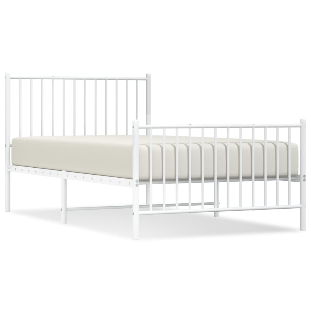 Line drawing of a white metal toddler bed with safety rails and dimensions labeled in cm and inches